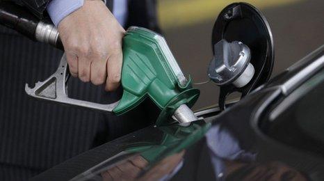 Man fills car up with petrol