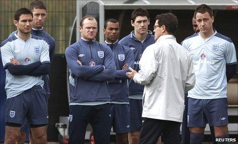 England coach Fabio Capello (second right) talks to (from left to right) Frank Lampard, Gary Cahill, Wayne Rooney, Ashley Cole, Gareth Barry and John Terry