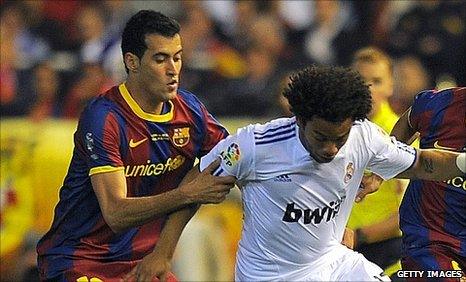 Sergio Busquets (l) and Marcelo (r)