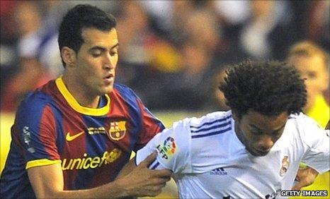 Sergio Busquets (left) and Marcelo (right)