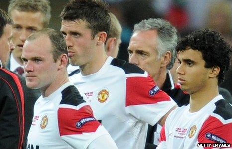 Wayne Rooney (left), Michael Carrick and Fabio da Silva