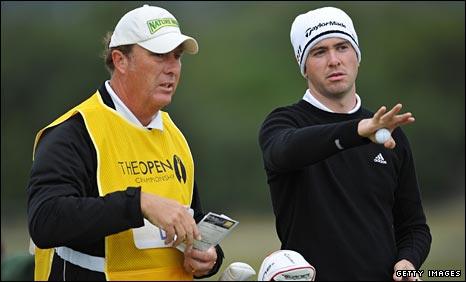 Martin Laird discusses with his caddie