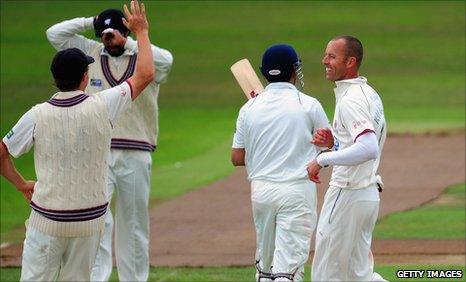 Charl Willoughby (right) celebrates the wicket of Gautam Gambhir