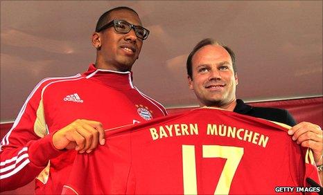 New Bayern Munich signing Jerome Boateng (left) with the club's sporting director Christian Nerlinger. Boateng has joined from Manchester City.