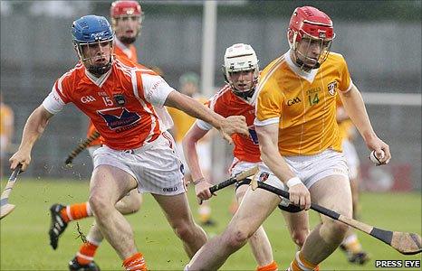 Armagh's Dean Nugent in action against Antrim captain Conor McCann