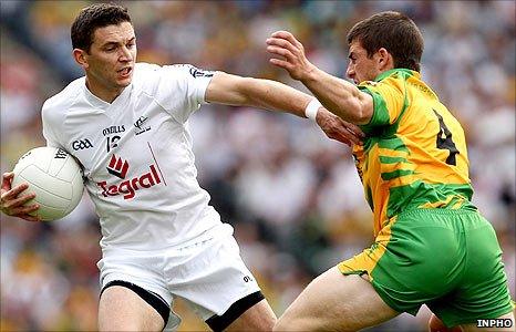 Kildare's Eamonn Callaghan fends off the challenge of Donegal opponent Paddy McGrath