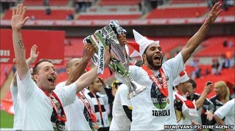 Swansea City's Stephen Dobie and Ashleigh Williams celebrate promotion to the Premier League