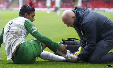 Emilio Izaguirre lies injured