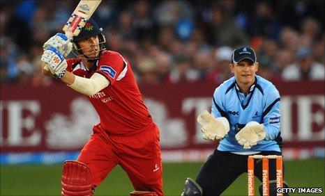 Lancashire's Paul Horton hits out, watched by Sussex keeper Ben Brown