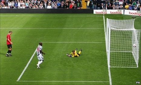 Manchester United goalkeeper David De Gea looks into the net after West Brom's Shane Long (not pictured) scores his side's equaliser