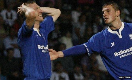 Birmingham's Stephen Caldwell (left) reacts next to team-mate Chris Wood