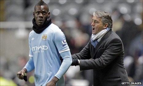 Mario Balotelli, left, and Roberto Mancini