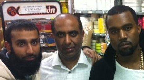 Kanye West with owners of East End fabric shop