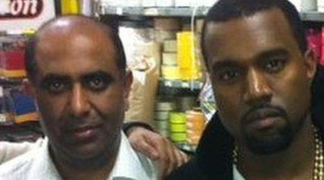 Kanye West with owners of East End fabric shop