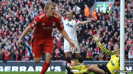 Dirk Kuyt celebrates scoring past arch rivals Manchester United at Anfield