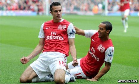 Robin van Persie celebrates his first goal with Theo Walcott