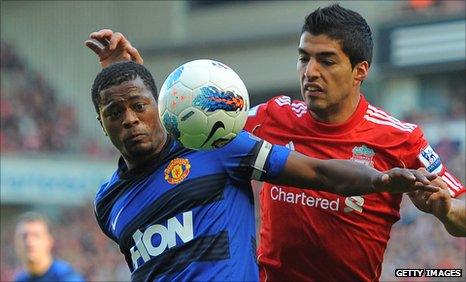 Patrice Evra and Luis Suarez