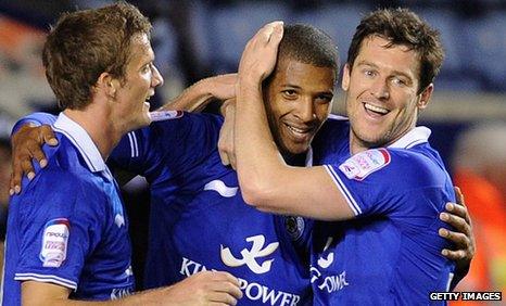 Jermaine Beckford is congratulated by Andy King (left) and David Nugent (right) after his goal