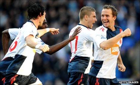 Kevin Davies (right) leads the celebrations after grabbing Bolton's opening goal