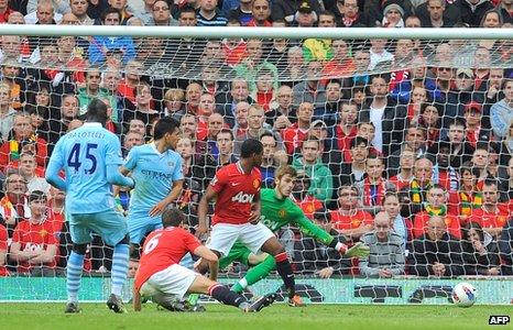 Mario Balotelli scores against Manchester United