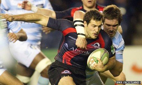 Edinburgh's Tim Visser is tackled by Bernard Le Roux