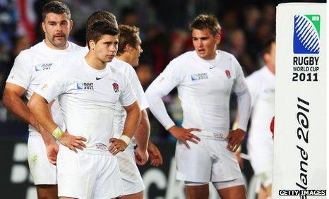 Ben Youngs (centre) and England team-mates after their Rugby World Cup defeat by France