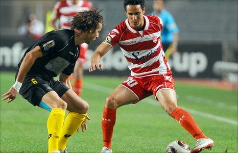 Smir Zekroumi of Moghreb Fes faces Youssef Mouihbi of Club Africain