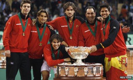 Spain's winning team with Rafael Nadal crouching at the front