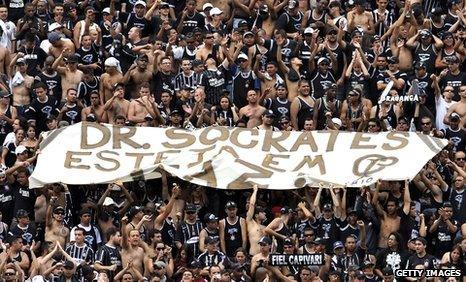 Corinthians fans hold up Socrates banner