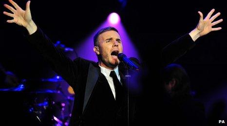 Gary Barlow on stage singing