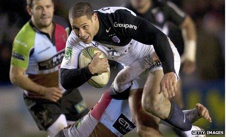 Toulouse fly-half Luke McAlister takes on the Harlequins defence