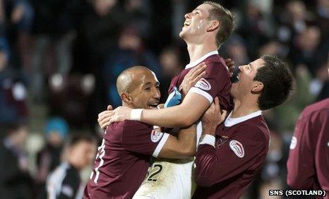 David Templeton (centre) is given a lift after scoring for Hearts