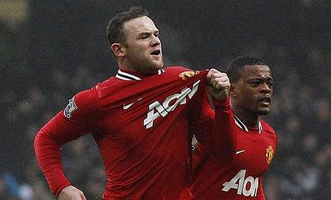 Wayne Rooney celebrates his first goal at the Etihad