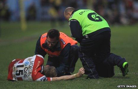 Olly Morgan receives treatment for an injury