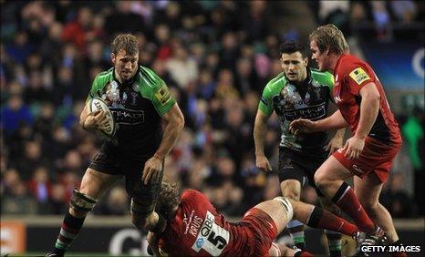 Chris Robshaw is tackled by Saracens' George Kruis