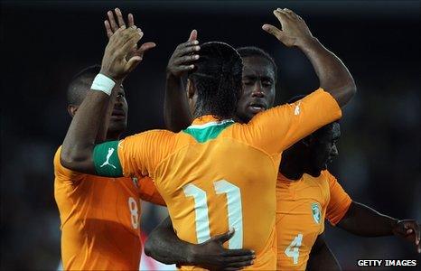 Didier Drogba (number 11) celebrates with fellow goalscorer Salomon Kalou (left)