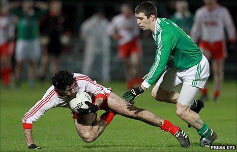 Tyrone's Jonathan Lafferty in possession against Barry Owens of Fermanagh