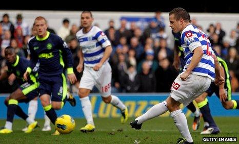 QPR striker Heidar Helguson opens the scoring against Wigan