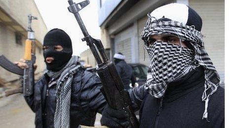 Syrian rebels holding rifles