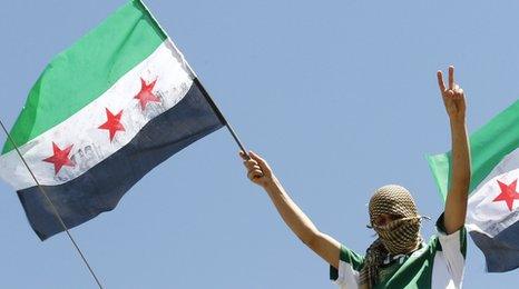 Refugee waves a Syrian Independence flag