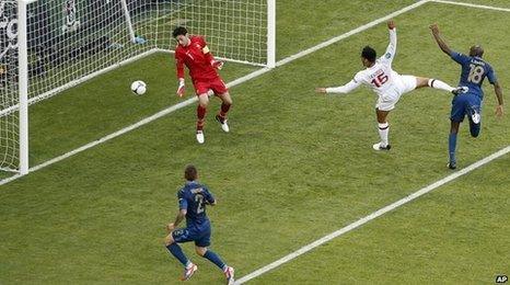 England's Joleon Lescott scores the opening goal past France goalkeeper Hugo Lloris.