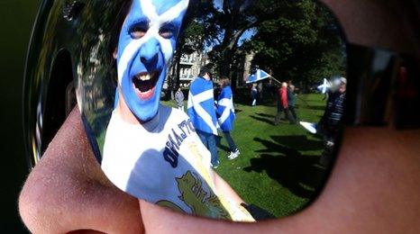 Scottish flag painted on a man's face
