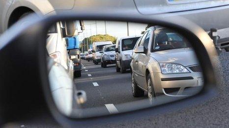 Traffic jam viewed through a wing mirror