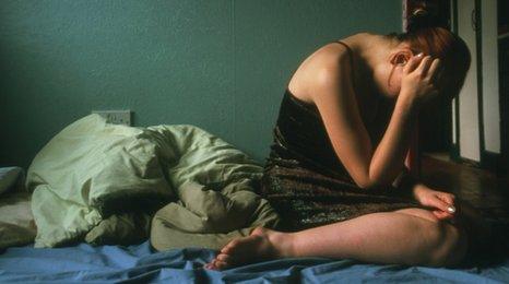 Depressed woman (portrayed by actress)