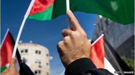 Palestinians wave flag at a recent national rally supporting the UN bid