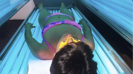 Woman on a sunbed