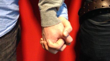 Gay men holding hands