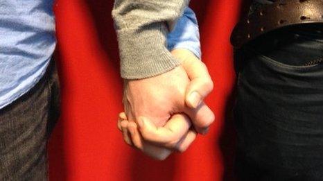 Gay men holding hands