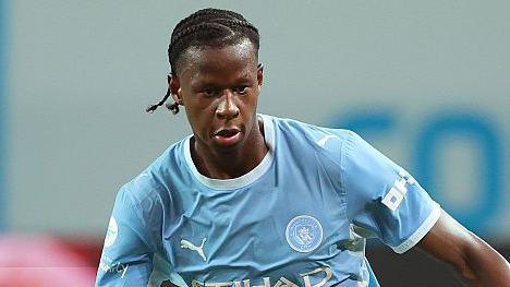 Stephen Mfuni in action for Manchester City