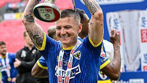 AFC Wimbledon v Walsall - Sky Bet League Two Play Off Final
James Tilley of AFC Wimbledon celebrates with the cup during the Sky Bet League 2 Play Off Final match between AFC Wimbledon and Walsall at Wembley Stadium in London, England, on May 26, 2025. 